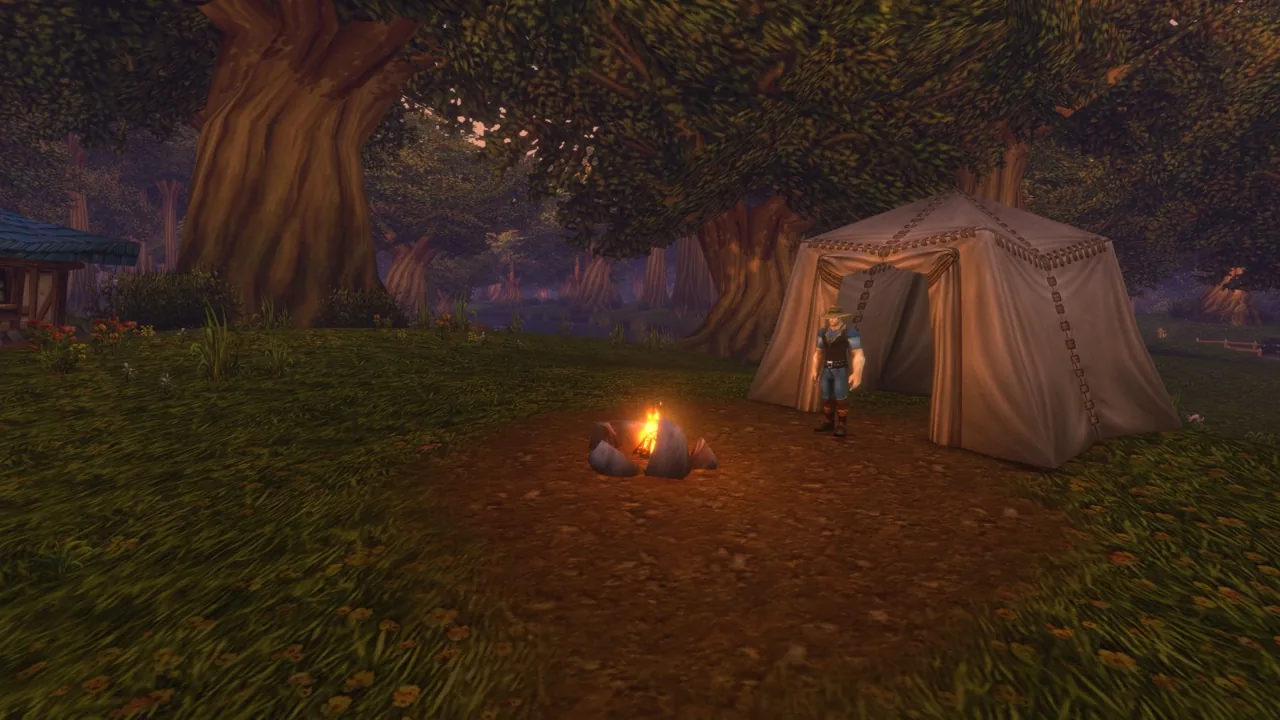Personnage devant une tente et un feu de camp dans la forêt.