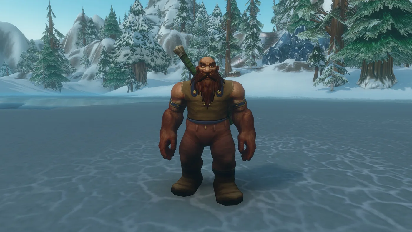 Personnage nain devant une forêt enneigée.