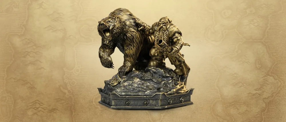 Statue du nain et de son ours sur un socle.